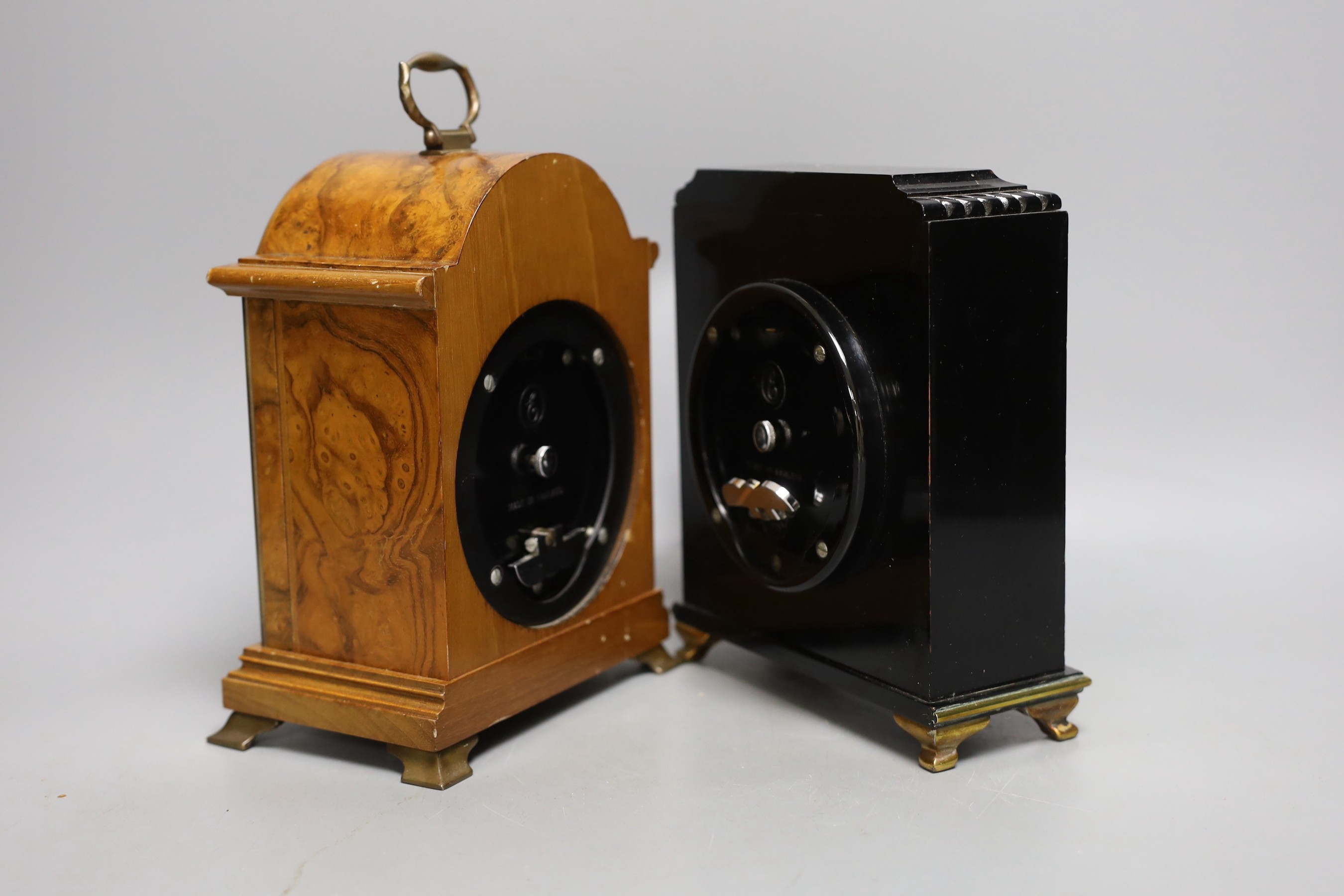 Two Elliott mantel clocks, one walnut and one lacquered.